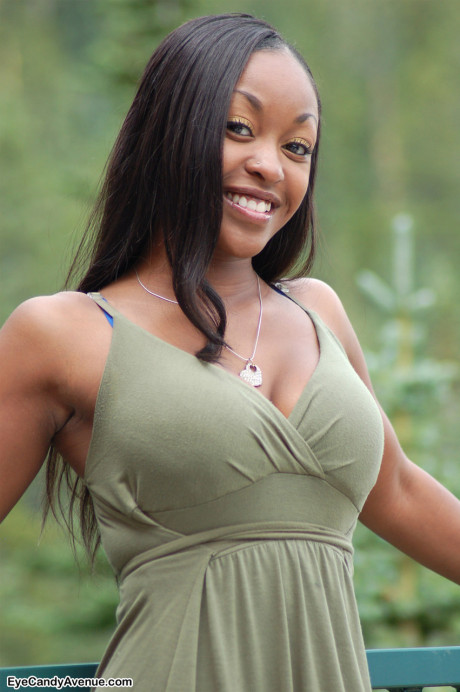 Ebony amateur Amber releases her big breasts from a long dress on a balcony - #156472