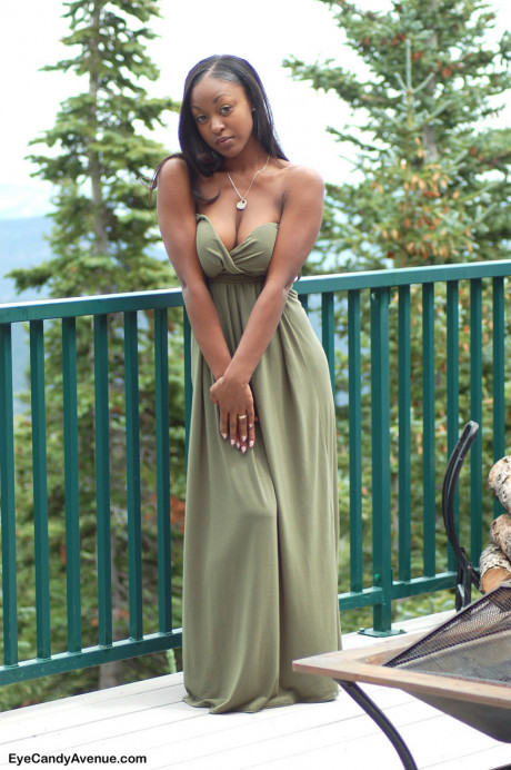Ebony amateur Amber releases her big breasts from a long dress on a balcony - #156479
