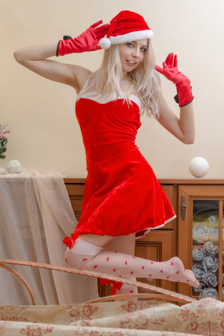 Fresh teen blonde Egida gets nude at Christmas in attractive OTK nylons and a cap - #327753