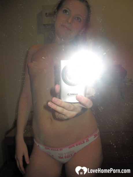 Sensational teenie takes hot selfies while posing naked in her living room - #921595