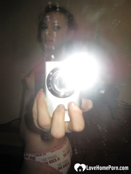 Sensational teenie takes hot selfies while posing naked in her living room - #921597