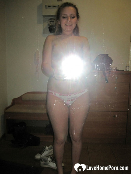 Sensational teenie takes hot selfies while posing naked in her living room - #921601
