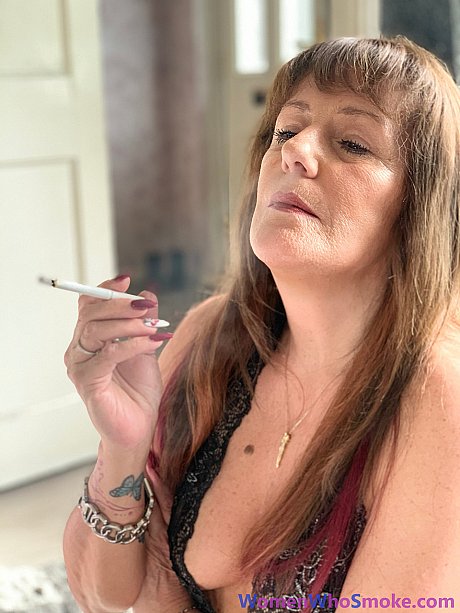 Badass cougar girl poses in her undergarment while smoking a cigarette - Image 4 of 15  in Non Nude category   featuring Pandora Smith 