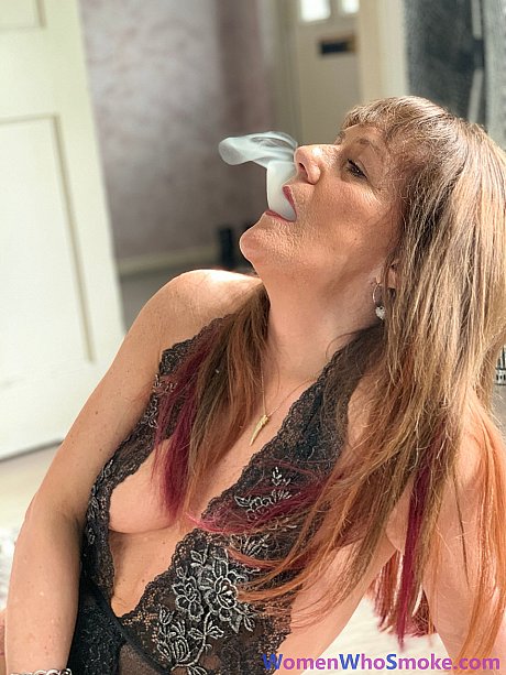 Badass cougar girl poses in her undergarment while smoking a cigarette - Image 10 of 15  in Non Nude category   featuring Pandora Smith 