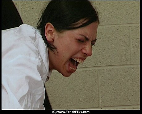 Schoolgirl receives a brutal caning over her desk from a male teacher - Image 3 of 12  in Skirt category  
