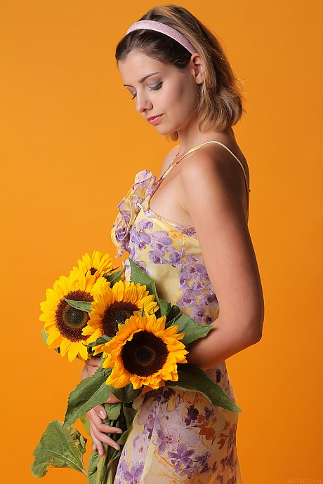 Pretty young sweety Vienna flaunts her humongous breasts and poses with sunflowers - Image 3 of 20  in Pussy category   featuring Vienna 
