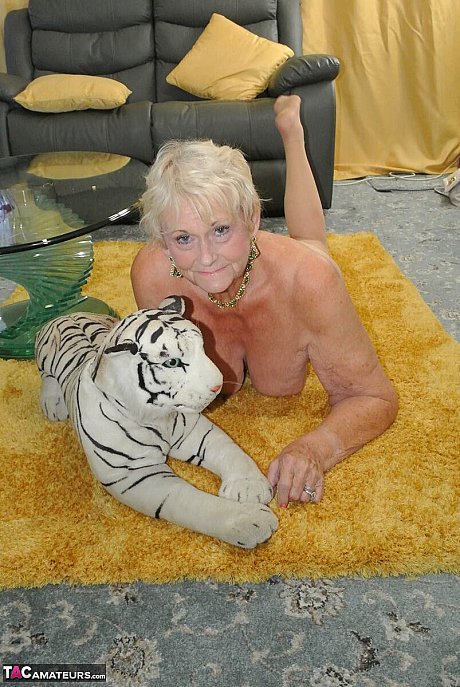Blondy grandma Sparkle sports a pair of stockings while posing in the undressed - Image 15 of 16  in Legs category   featuring Sparkle 