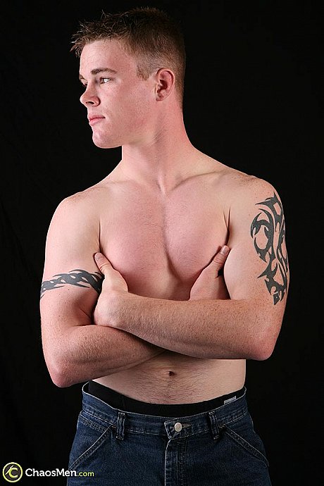 Teenage gay model Scott strips in a solo & displays his inked body & gigantic penis - Image 3 of 21  in Gay category  
