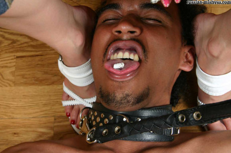 Yellow-haired broad uses her submissive black slave as a human ashtray - #1046144