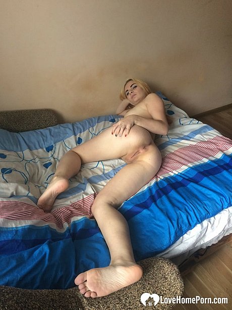 Yellow-haired babe undresses & displays her shaved cunt up close in a homemade scene - Image 14 of 20  in Pussy category  