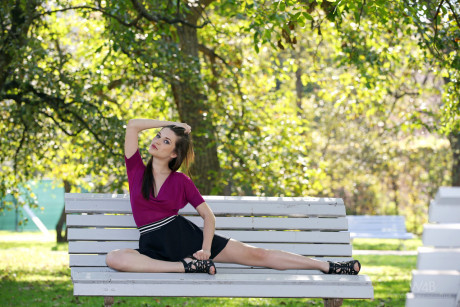 Ravishing European babe Serena poses on a park bench in a lovely short skirt - #248527