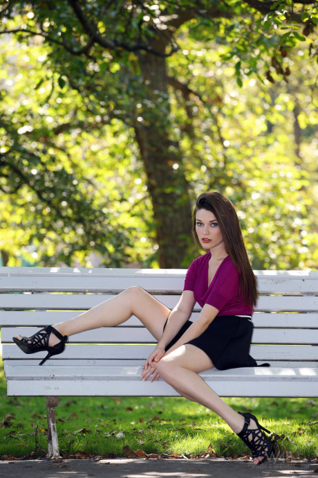 Ravishing European babe Serena poses on a park bench in a lovely short skirt - #248529