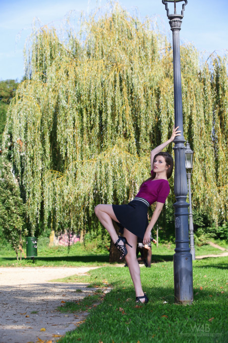 Ravishing European babe Serena poses on a park bench in a lovely short skirt - #248533