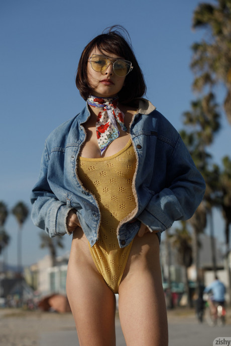 Adorable teen Basil Navas poses on the beach in yellow see-through bodysuit - #1079623