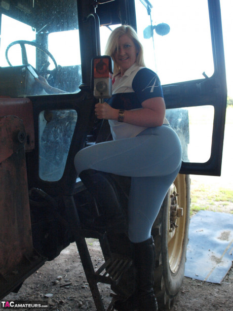 Amateur BBW Samantha strips to knee-high ebony boots on a farm tractor - #155480