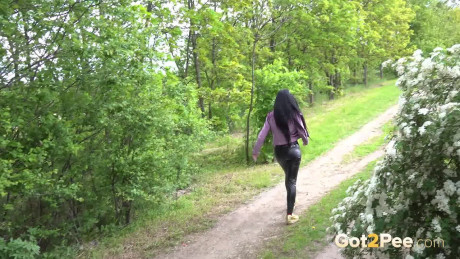 Solo girl gf woman Isabel Dark pulls down leather pants to pee on a dirt road - #273354