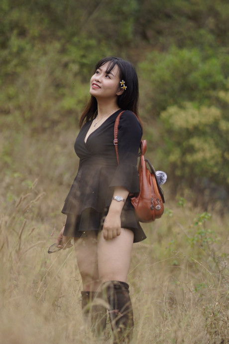 Pretty asian babe posing in her black dress and boots in nature - #1100105