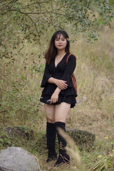 Pretty asian babe posing in her black dress and boots in nature - #1100111