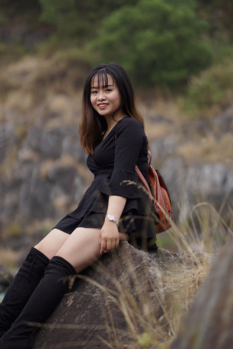 Pretty asian babe posing in her black dress and boots in nature - #1100115