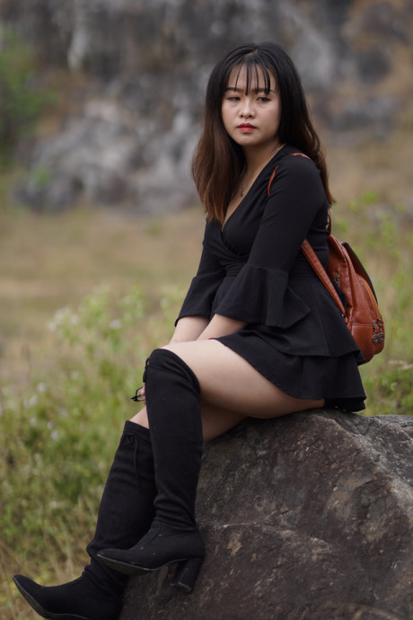 Pretty asian babe posing in her black dress and boots in nature - #1100117