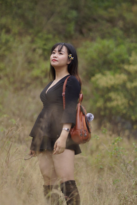 Pretty asian babe posing in her black dress and boots in nature - #1100124