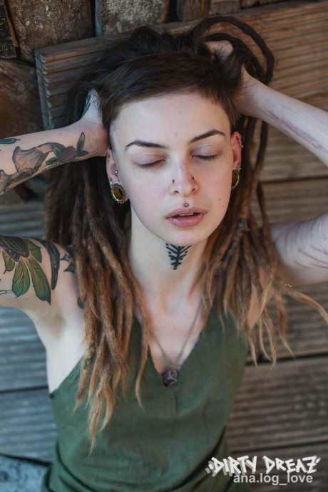 Tattooed female Cutz sports dreadlocks while showing her tiny breasts - #482404
