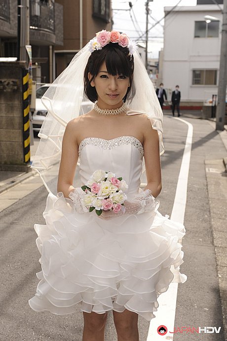 Pretty Japanese bride Ruri Narumiya poses on the street during her massive day - Image 1 of 15  in Outdoor category   featuring Ruri Narumiya 