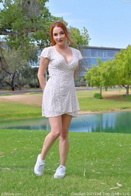 Pretty redheaded babe Jackie exposes her firm breasts & flashes her cunt outdoors - #888505
