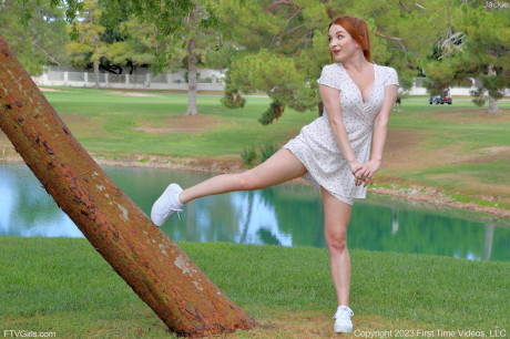 Pretty redheaded babe Jackie exposes her firm breasts & flashes her cunt outdoors - #888514