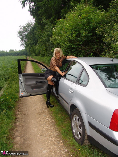 Mature woman lovely Susi exposes herself in country lane wearing OTK boots - #1023152