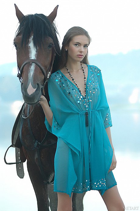 Slim white lady girl broad Alena I goes unclothed while tending to her horses - Image 1 of 17  in Model category   featuring Alena I 