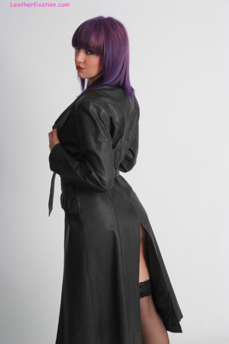 Tall female Sammi frees her firm titties from a leather trench coat in hosiery - #558735