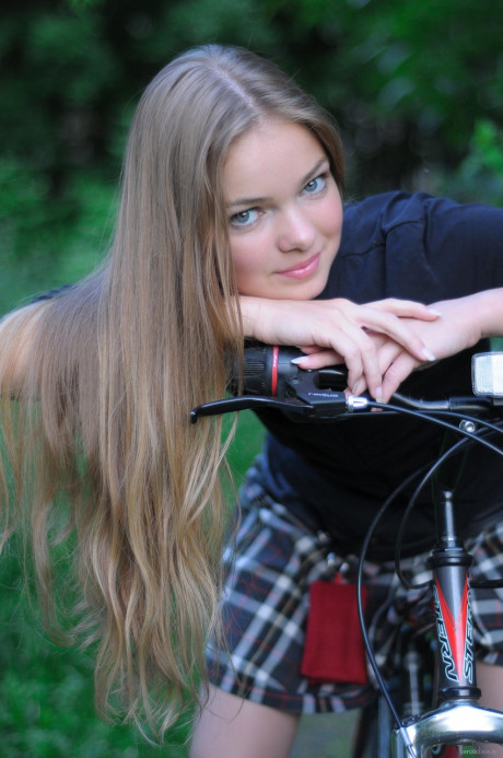 Ravishing teen babe Bridgit A riding her bicycle pantyless in nature - #622753
