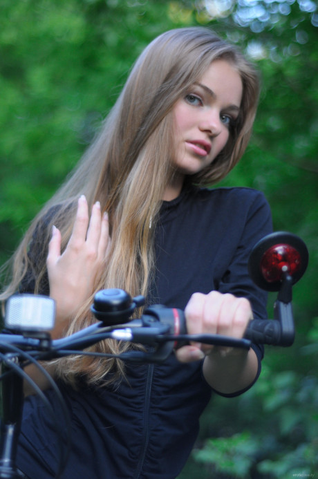 Ravishing teen babe Bridgit A riding her bicycle pantyless in nature - #622755