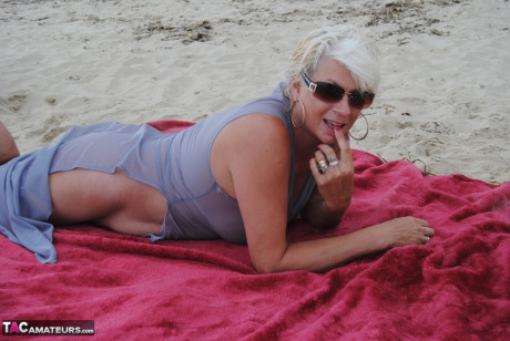 Stunning busty older Dimonty poses fully clothed in sheer dress at the beach - #1328390