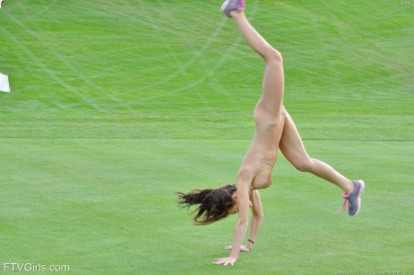 Fit girl lady strips off sports workout clothes to model undressed on golf course - #1012688
