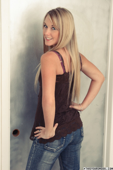 Ravishing blonde holds her denim jeans after getting naked - #561392