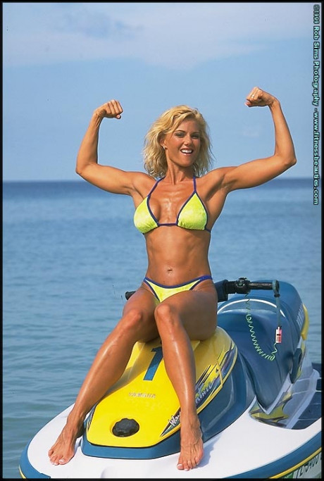 Blondie fitness model Stephanie Metzdorf poses in a bikini on top of a jet ski - #610720
