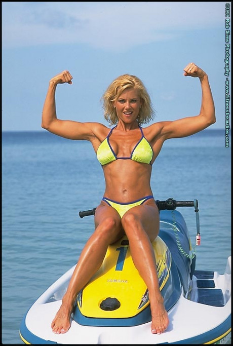 Blondie fitness model Stephanie Metzdorf poses in a bikini on top of a jet ski - #610731