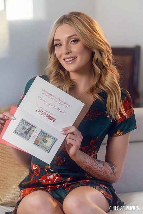 Pretty blondy pornstar poses on a couch and flashes her small pierced breasts - Image 8 of 14  in Babe category   featuring Charlotte Sins 