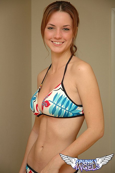 Fresh teenie solo skank girl woman Amy wears a smile while posing non undressed in a string bikini - Image 4 of 12  in Close Up category  