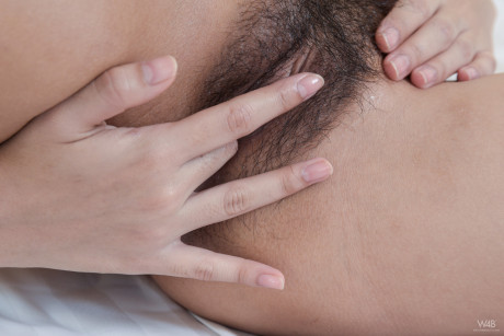 Oriental honey with hot monstrous breasts Kahlisa fingers her furry beaver on a bed - #1547179