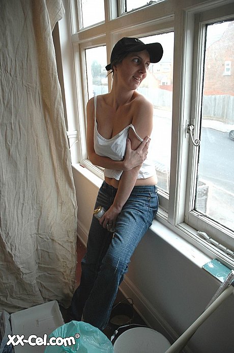Amateur cougar in a cap Kim squeezes her massive titties and poses - Image 1 of 20  in Close Up category   featuring Kim 
