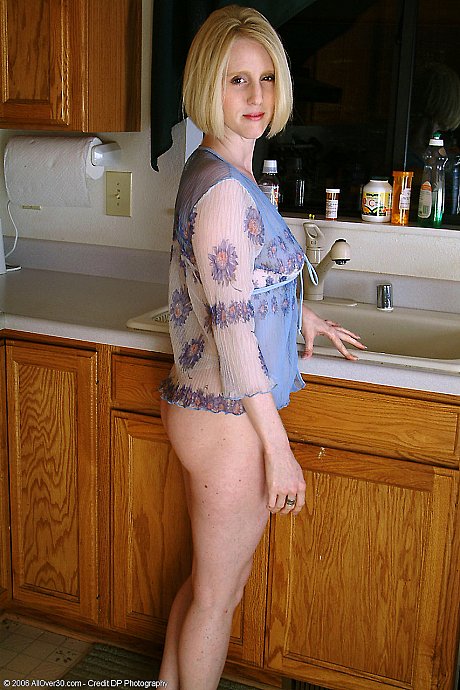 Playful housewife Lydia washing her incredible body in the cuisine sink - Image 2 of 20  in Pussy category   featuring Lydia 