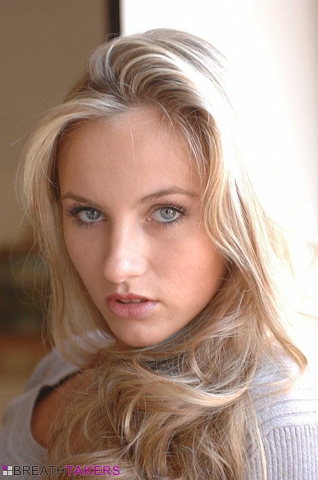 Yellow-haired girl girl woman with a stunning sweet face reveals her nice boobies as she undresses - Image 3 of 12  in Model category  