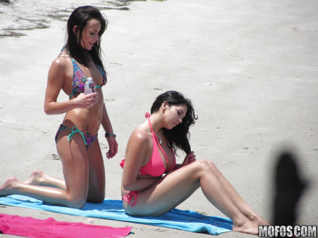 Sassy brunettes get caught on voyeur video having some fun on the beach - #502350