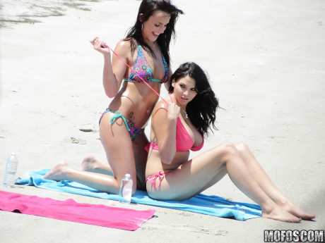 Sassy brunettes get caught on voyeur video having some fun on the beach - #502351