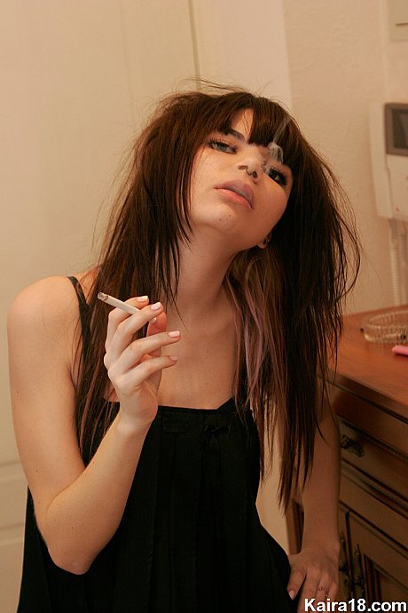 Thin teenie Kaira 18 smokes a cigarette while getting nude in her bedroom - Image 4 of 15  in Babe category   featuring Kaira 18 