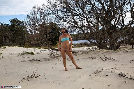 Brunette MILF Roxeanne gets completely nude during solo action at the beach - Image 1 of 16  in Pussy category   featuring Roxeanne 