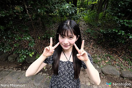 Japanese teenie Nono Mizumori makes a peace sign before changing into lingerie